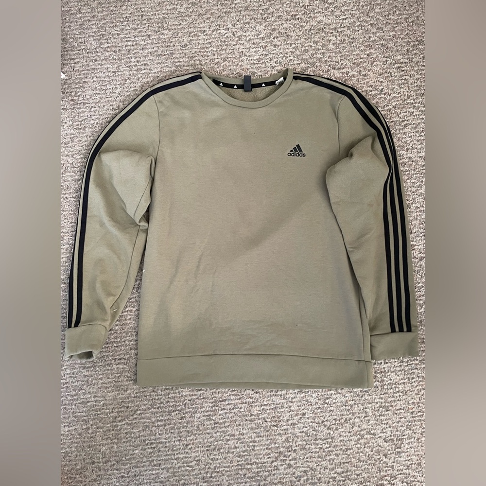 Green Adidas sweatshirt.